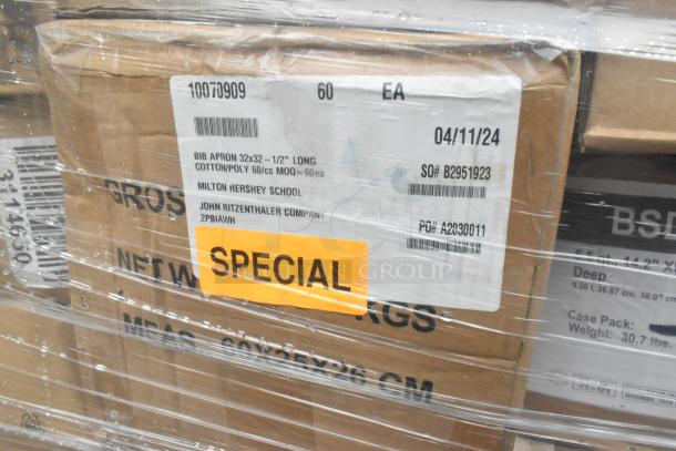 Box labeled "Special" containing scratch and dent items wrapped in plastic, including Easy Chopper and aprons.