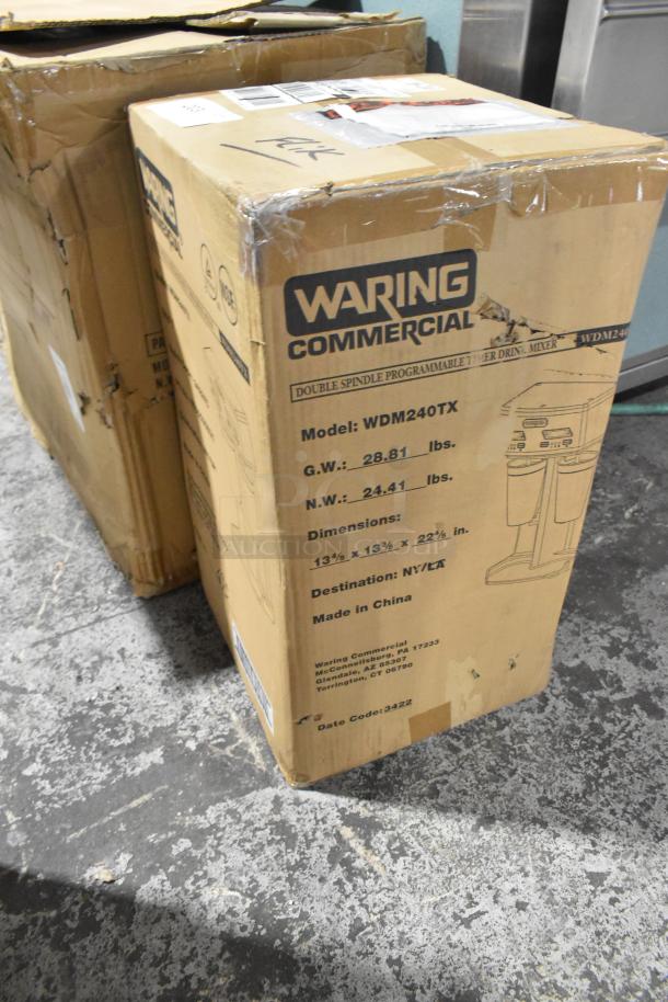 Brand new Waring WDM240TX metal countertop drink mixer in scratched box. 115V, 1 Phase. Box shows model and weight details.