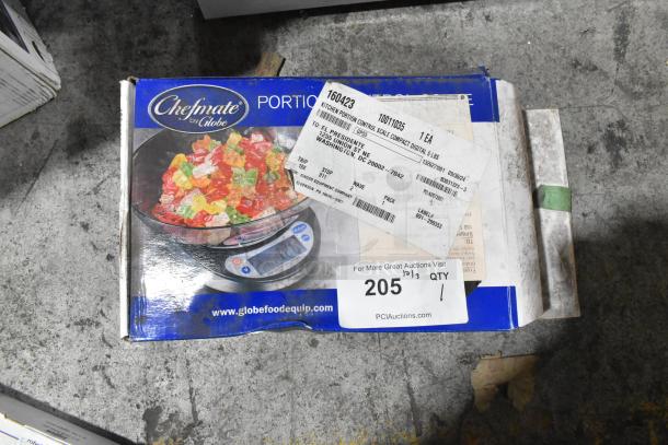 Brand new Globe Chefmate GPS5 scale, 5 lb capacity, in box with slight dents. Shipping labels visible.