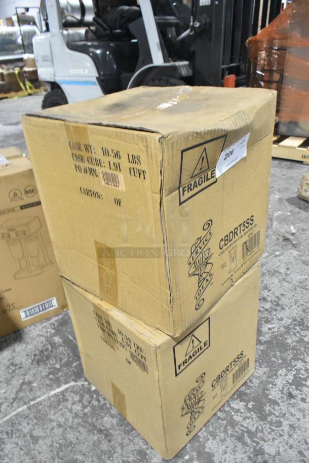 Two cardboard boxes labeled "Service Ideas 5 gal Beverage Dispenser w/ Infuser & Ice Tube," new, with fragile markings.