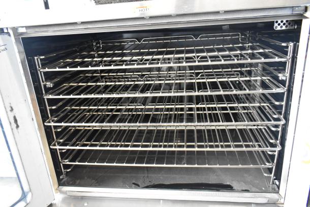 Brand new 2025 Southbend Platinum Series stainless steel commercial convection oven with metal racks and view-through doors.