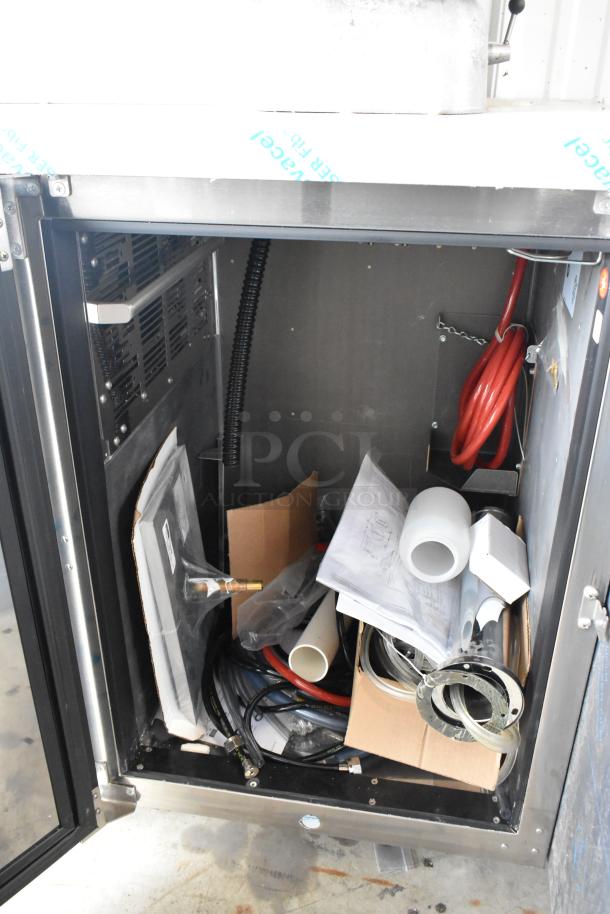 Brand new Perlick DDS36 stainless steel kegerator, 115 volts, showing interior with hoses and parts. Scratch and dent condition.