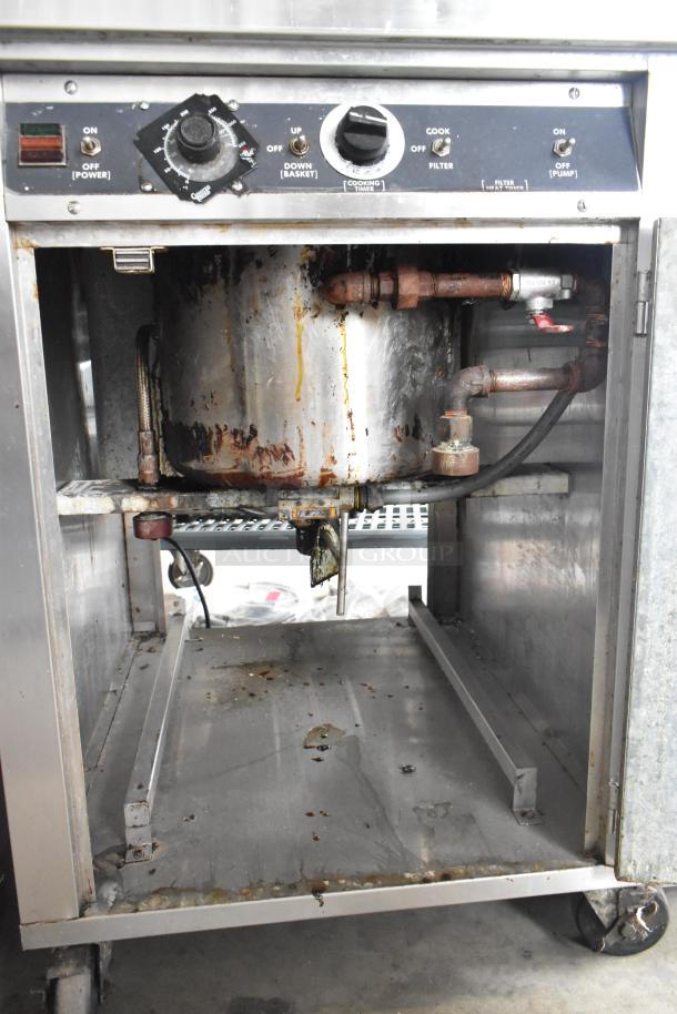 Giles stainless steel commercial electric deep fat fryer with ventless grease hood, 208V, 3-phase. Used condition with wear.