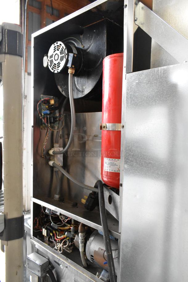 Giles stainless steel commercial electric fryer with ventless grease hood, 208V, 3 phase, featuring internal wiring and components.