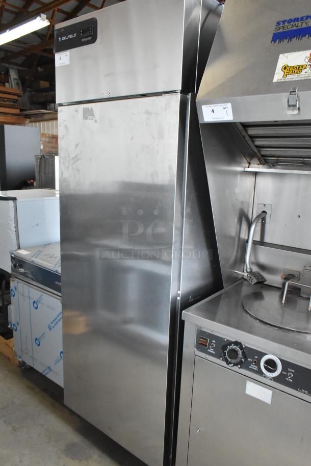 2022 Delfield GBSR1P-S stainless steel single-door reach-in cooler with poly coated racks, on commercial casters.