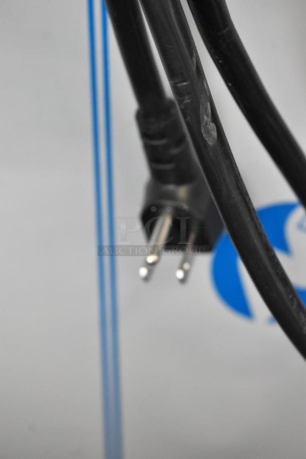 Power cord of Alto Shaam 750-S heated holding cabinet. Stainless steel with commercial casters. Door issue noted.