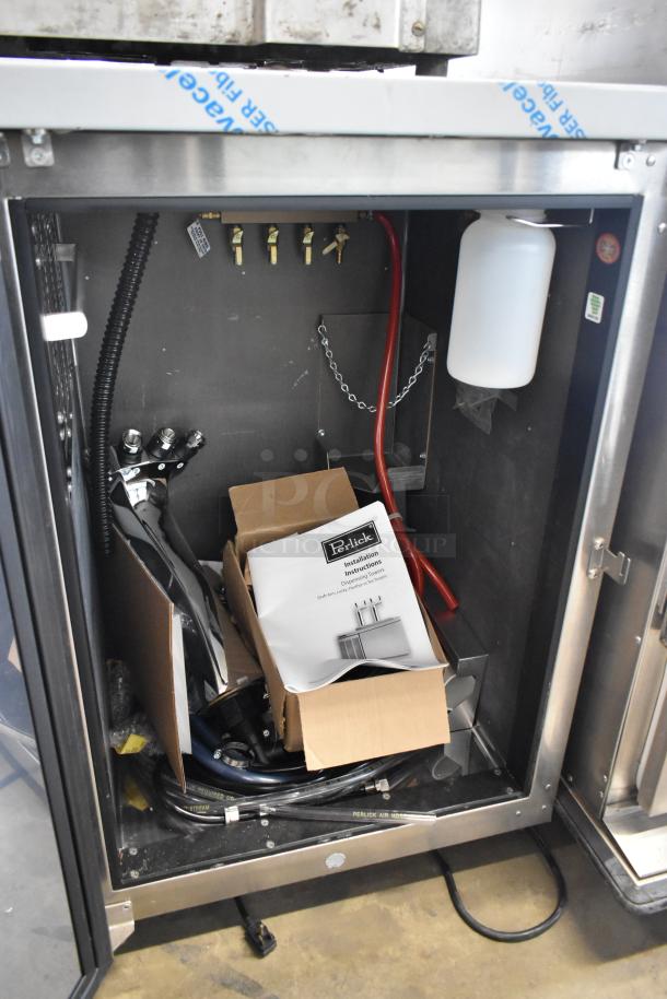 Brand new Perlick DDS36 stainless steel kegerator with installation instructions, hoses, and components visible inside. 115 volts, 1 phase.