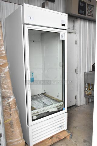 Brand new True TSCI-600R-G-PH commercial reach-in cooler with poly coated racks. Single glass door, 115V, minor scratches.