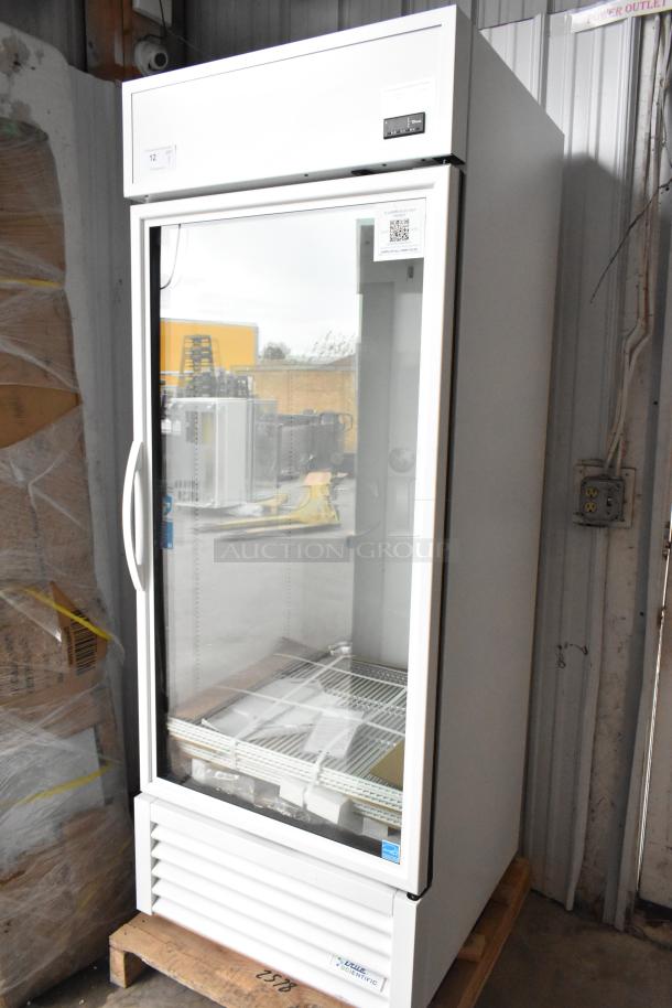 Brand new True TSCI-600R-G-PH commercial cooler merchandiser with glass door, white exterior, and poly-coated racks.
