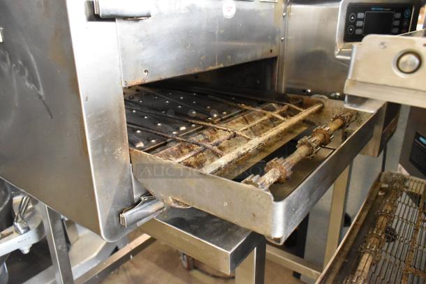 Turbochef HhC2020 stainless steel conveyor pizza oven, electric, on casters, visible wear, 208/240 volts, 1 phase.