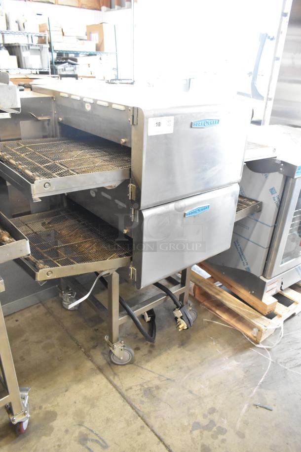 Turbochef HhC2020 stainless steel conveyor pizza oven on casters. Electric, 208/240V, 1 phase. Two stacked units.