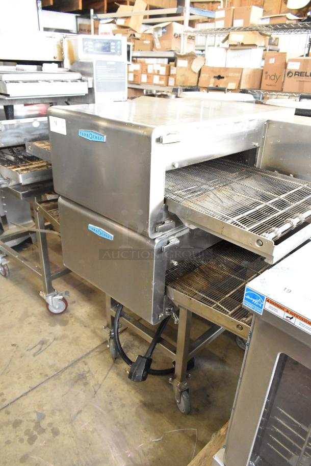 Two Turbochef HhC2020 stainless steel conveyor pizza ovens on casters, 208/240V, 1 Phase, with visible branding.