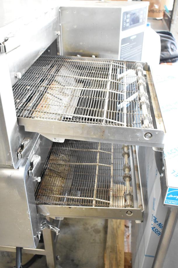 Turbochef HhC2020 stainless steel commercial conveyor pizza oven on casters, 208/240 volts, 1 phase, excellent condition.