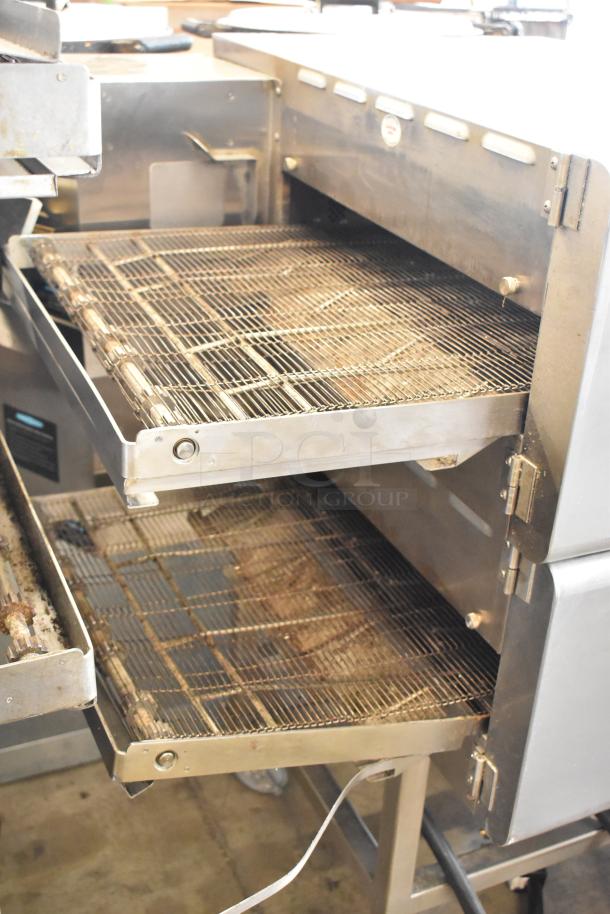 Turbochef HhC2020 stainless steel conveyor pizza oven on casters, electric, 208/240V, 1 phase, dual stack, commercial use.