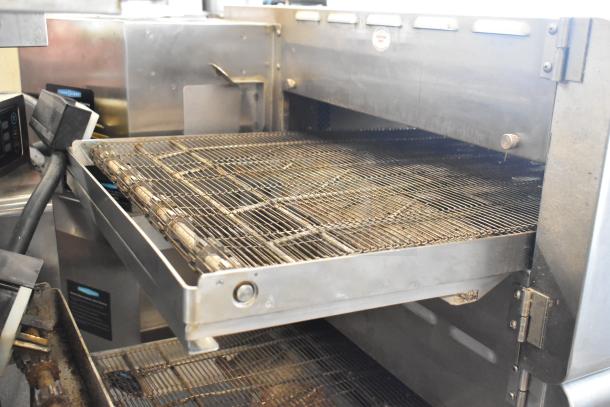 Turbochef HhC2020 stainless steel conveyor pizza oven on commercial casters, electric-powered, 208/240V, 1 phase.