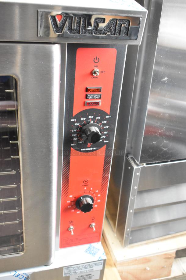 Brand new Vulcan VC4GD-11D150K stainless steel convection oven with view-through doors, metal racks, and thermostatic controls.