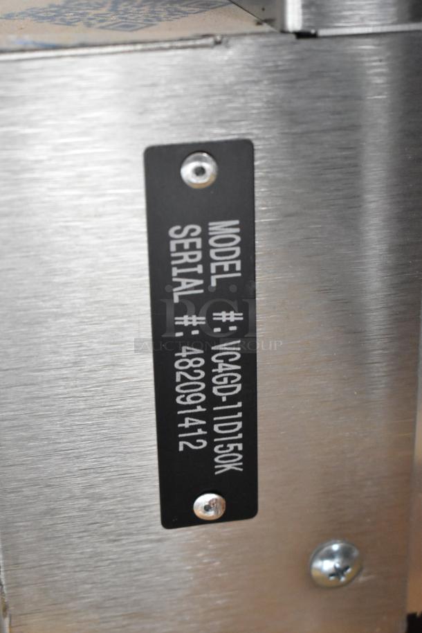 Vulcan VC4GD-11D150K convection oven serial plate, showing model and serial number. Stainless steel surface.