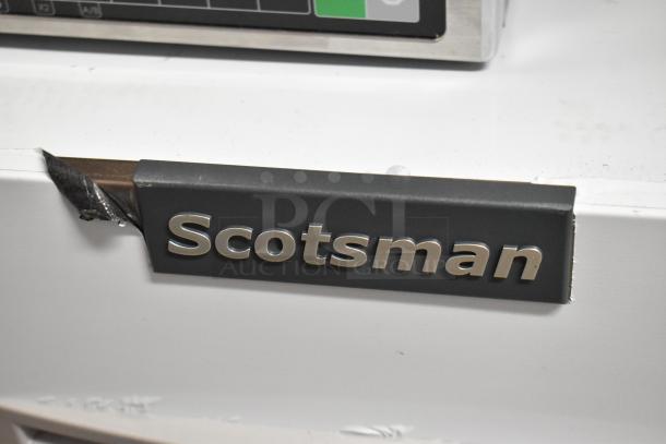 Stainless steel Scotsman MC0330SA-1A commercial ice machine, 115V, 1 phase, minor dents, "Scotsman" logo visible.