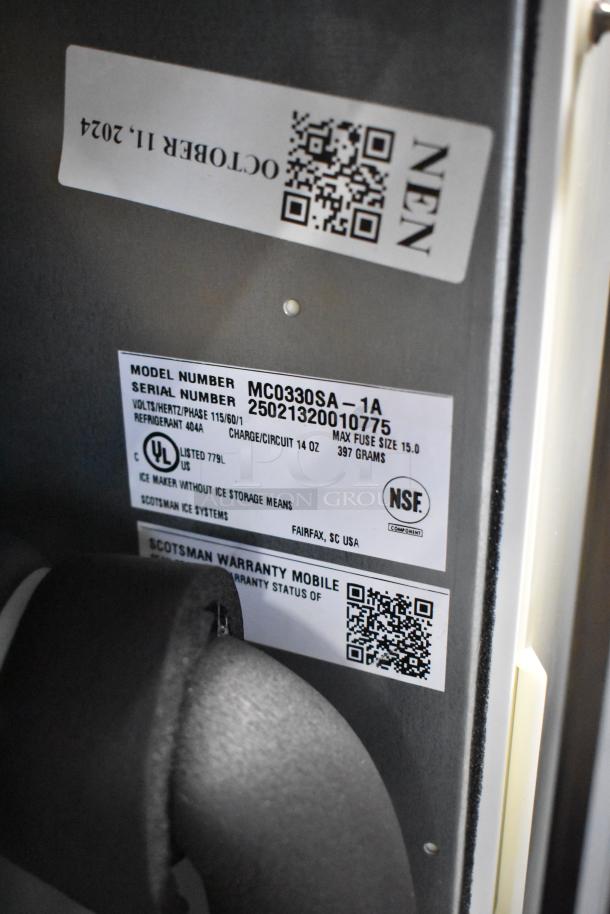 Brand new Scotsman MC0330SA-1A ice machine, 115V, 1-phase, stainless steel, scratch and dent, model and warranty labels shown.