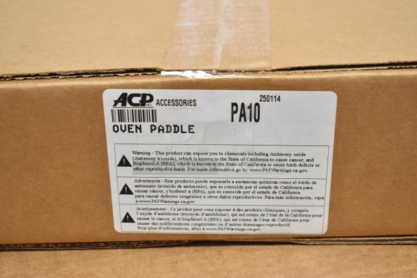 Cardboard box labeled "ACP Accessories" with item code "PA10" and "Oven Paddle." Contains chemical exposure warning.