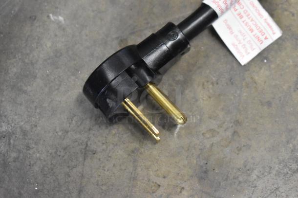 Close-up of the power plug for the XpressChef MXP22TLT high-speed cooking oven, showing voltage and usage label.