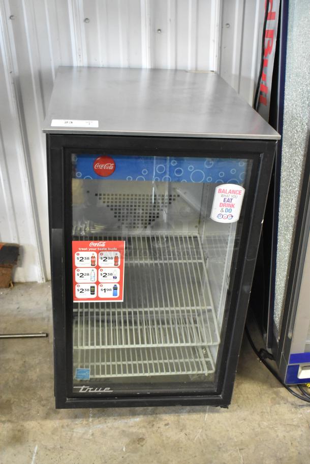 2019 True GDM-06-34-HC metal mini cooler merchandiser, glass door, 115V, 1 phase, Coca-Cola branding, interior shelves.