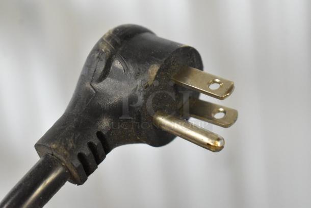 Close-up of a power plug attached to the 2019 True GDM-06-34-HC mini cooler merchandiser, 115V, 1 phase.