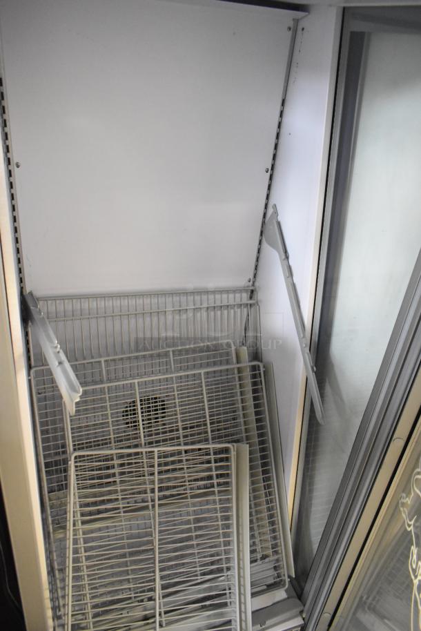 2021 Iarp GDC LARGE single door cooler merchandiser, damaged glass, metal frame, grid shelves. 115V, 1 phase.