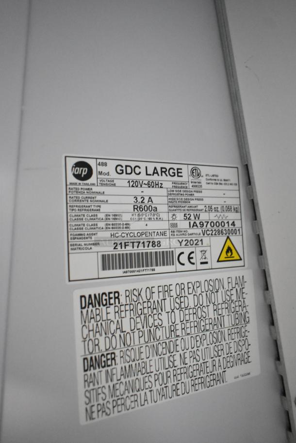 2021 Iarp GDC LARGE single door reach-in cooler; label displays voltage, refrigerant type, and warnings. Glass broken.