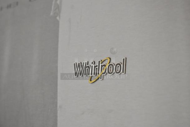 Brand new 2025 Whirlpool WRT511SZDM00 stainless steel cooler with freezer. Minor scratches and dents visible.