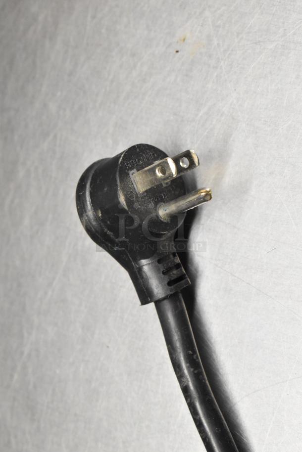 Power plug of True GDM-06-34-HC mini cooler merchandiser, 115 volts, black cord, used condition.