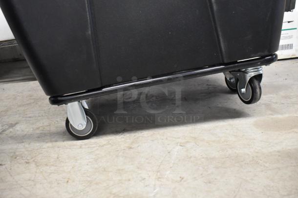 Brand new Lavex black poly tilt truck with commercial casters, scratch and dent condition. Durable and mobile design.