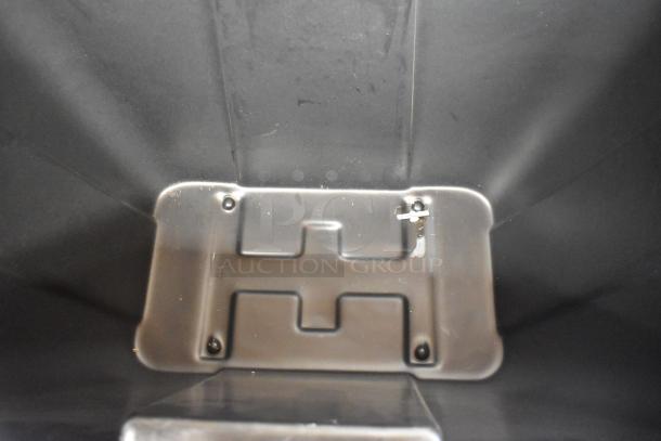 Brand new Lavex black poly tilt truck, scratch and dent, on commercial casters, close-up interior view.