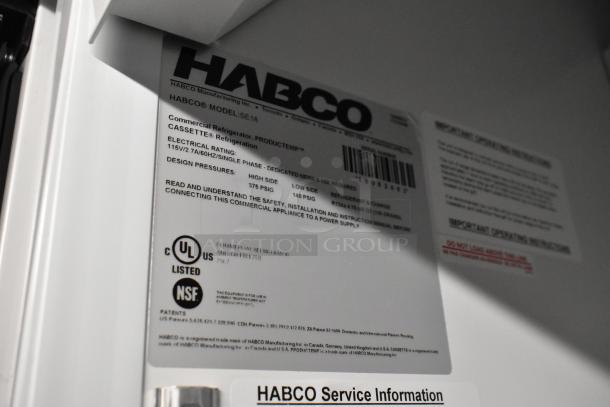 Close-up view of label on 2019 Habco SE18 commercial reach-in cooler, showing model and electrical specifications.