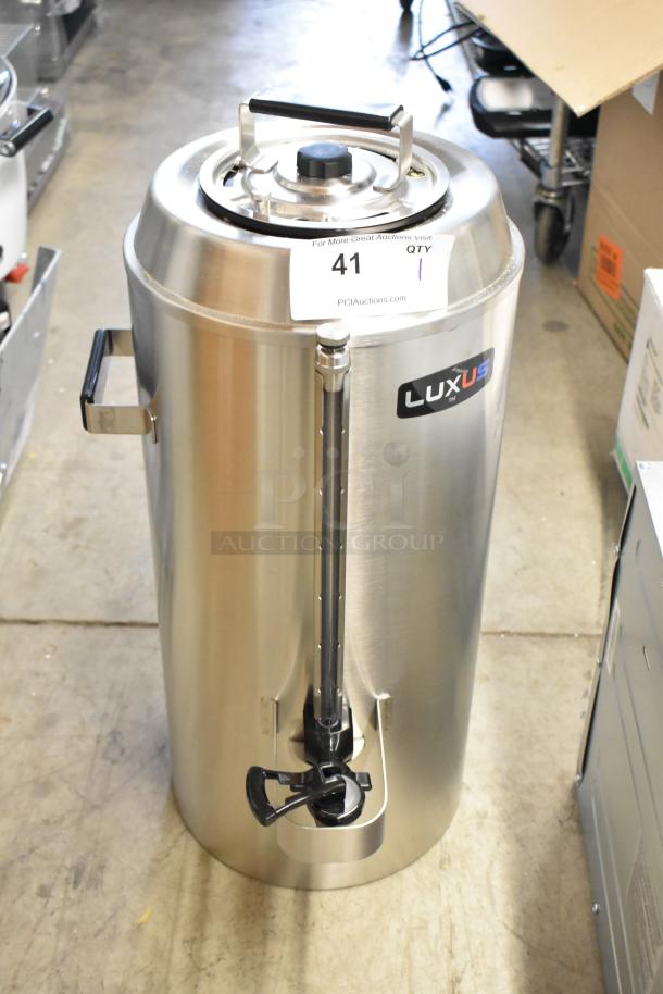 BRAND NEW SCRATCH AND DENT! Fetco Luxus TPD-30, 3-gallon stainless steel coffee dispenser, visible minor imperfections.