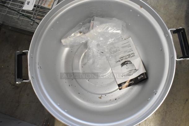 Brand new Avantco 177GRCB110NAT gas rice cooker, 110 cup capacity, includes manual and accessories, slight scratches visible.