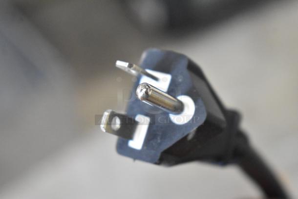 Close-up of a power plug for Avantco 177IC35SU induction range, illustrating the 208-240 volts requirement.