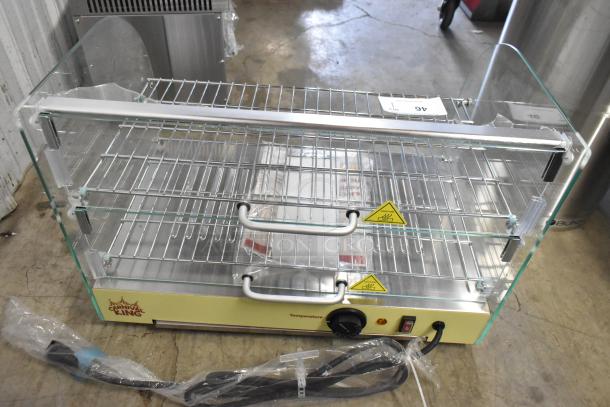 Carnival King 382HDCG2A hot food display case, silver, 2 shelves, broken curved front glass, 120V, 1 phase. Brand new.