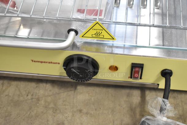 Carnival King 382HDCG2A hot food display case. Features temperature dial, caution label, and broken curved front glass.