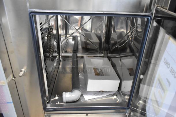 Bakers Pride AEHE061R stainless steel combi convection oven, new with minor scratches, 208V, 3-phase, interior view.