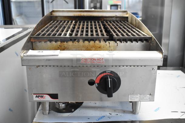 APW Wyott stainless steel commercial countertop gas charbroiler grill, visible "Caution Hot" warning, used condition.