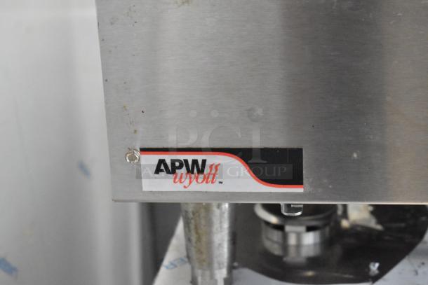 APW Wyott stainless steel commercial countertop gas charbroiler, featuring a visible brand label and sturdy construction.
