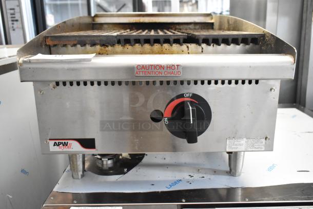 APW Wyott stainless steel gas charbroiler grill, commercial countertop model, showing wear. Control knob reads "Off/On."