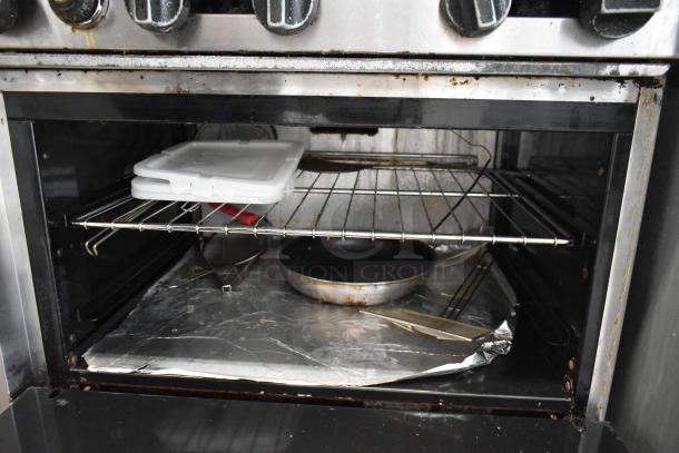 American Range AR-6 stainless steel commercial gas range with 6 burners, oven interior, salamander, cheese melter, and back splash.