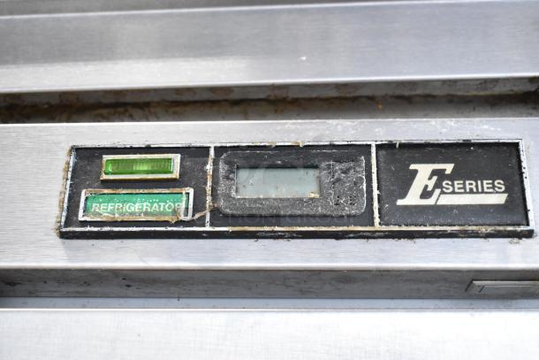 Beverage Air ER24-1AS stainless steel reach-in cooler panel with "E Series" label and worn display controls.
