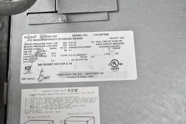 Manitowoc stainless steel ice head on bin, 208-230V, 1 phase. Label shows model 30W-261, UL listed, R404A refrigerant.