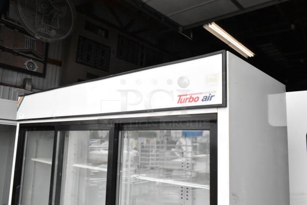 Turbo Air TGM-69R 3-door reach-in cooler with poly-coated racks. Metal exterior, 115V, 1 phase. Brand label visible.