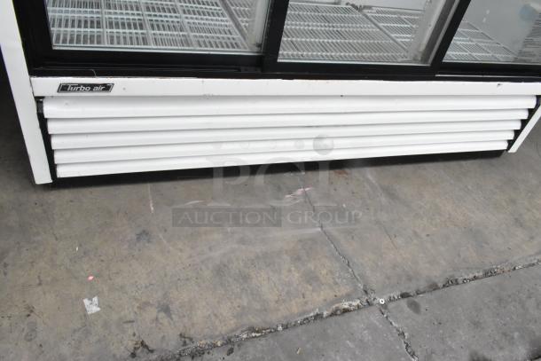 Turbo Air TGM-69R commercial 3-door cooler with poly-coated racks, showing exterior branding and metal finish. 115 volts, 1 phase.