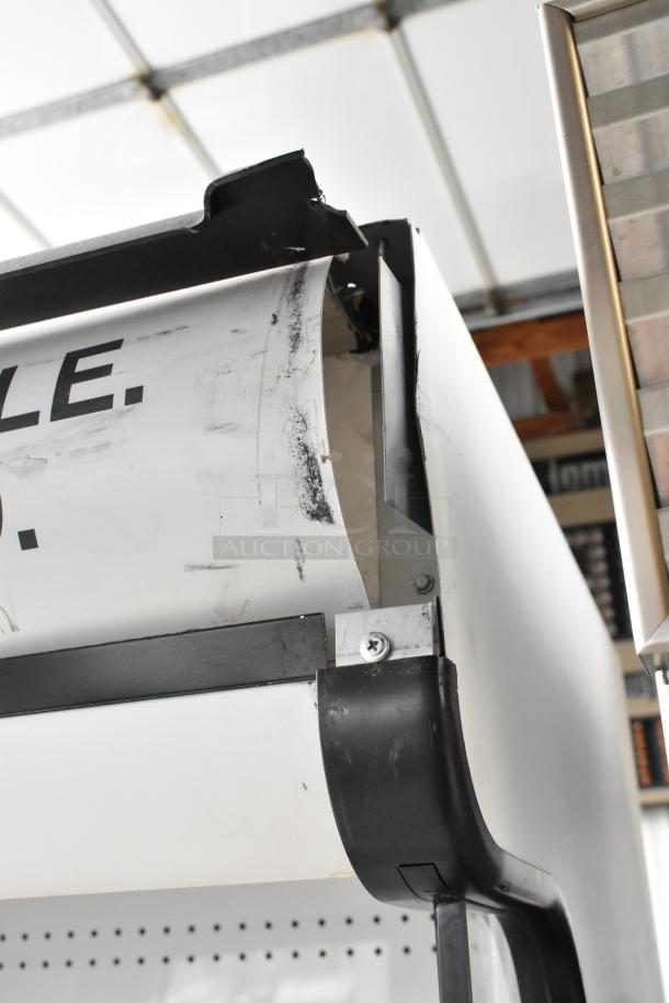 True TAC-48GS-LD commercial merchandiser, showing minor wear and black edge details. 115V, 1-phase condition.