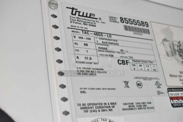 True TAC-48GS-LD Merchandiser label showing model, refrigerant type, voltage, and patent info. NSF and UL listed.